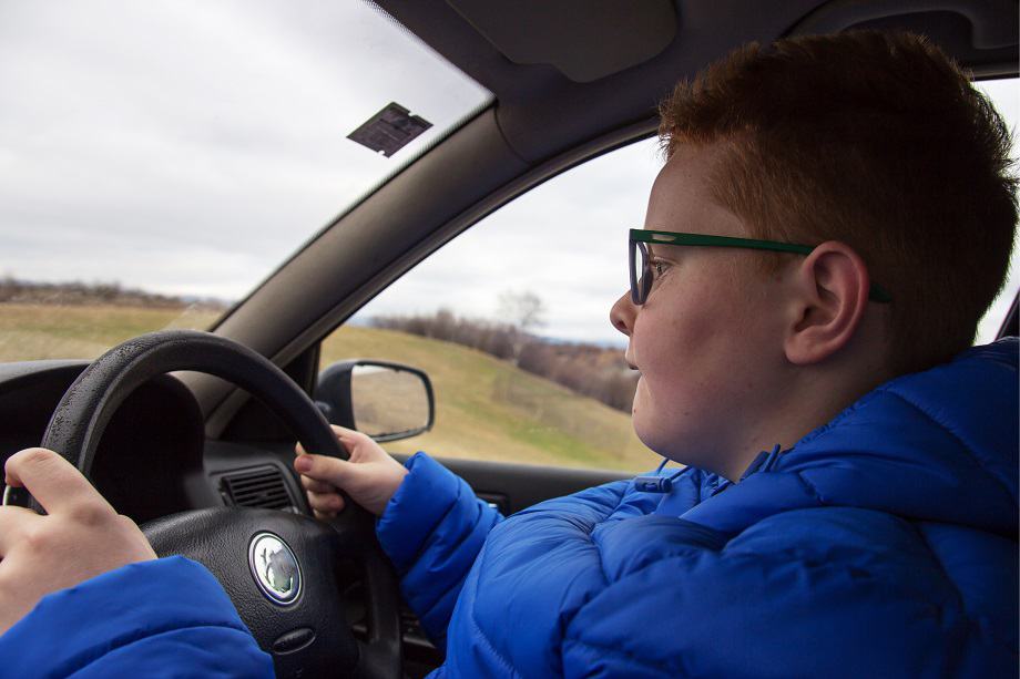 a small boy driving